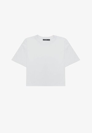 T-shirt bianca corta in cotone, con collo rotondo e maniche corte. L'etichetta sul colletto reca la scritta "BALMOHK". Design semplice e sobrio.