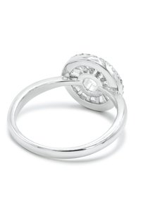 Silver ring with a round, elevated stone setting, featuring a textured band and transparent center. Smooth finish reflects light.