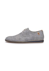 Scarpa di tela grigia con una texture liscia, punta rotonda e lacci chiari. Presenta un'accoppiatura color tan vicino al tallone e una suola in gomma blu.