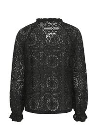 Black lace blouse with a floral pattern, long sleeves, and a ruffled neckline. Features intricate cut-out designs and elasticized cuffs.