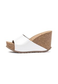 White wedge sandal with open toe, cork platform, and textured sole. Smooth upper with a curved, high back design.