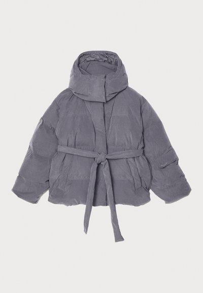 Gray puffer jacket with a high collar, belted waist, and wide sleeves. Made of soft, textured fabric with stitched sections throughout.