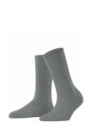 Calze in cotone grigie a coste, di altezza media, con una trama liscia e tallone e punta rinforzati. Design semplice senza fantasie.