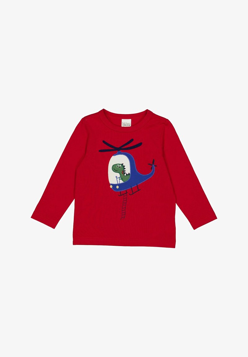 Červená košile s dlouhým rukávem, na které je modrá grafika vrtulníku se dinosaurem uvnitř. Vyrobeno z měkké bavlny s kulatým výstřihem.