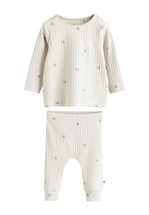 Cream ribbed long-sleeve baby top and pants with gray star prints and small rainbow embroidery on the top's chest.