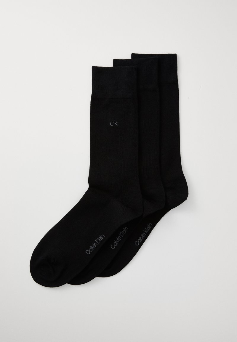 Schwarze Baumwollsocken im Dreierpack. Mit gerippten Bündchen und einem kleinen "ck"-Logo auf jeder Socke. Glatte Textur mit klassischem Design.