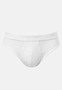 Slip in cotone bianco con una texture liscia, dotato di un cinturino rinforzato e una borsa sagomata per un maggiore supporto e comfort.