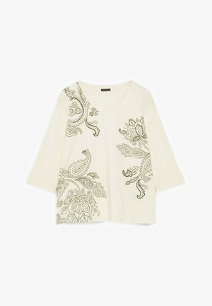 Langärmeliges Oberteil in Cremefarbe mit V-Ausschnitt und fein gearbeiteten dunklen Paisley-Blumenmustern auf der linken Schulter, unten rechts und am rechten Brustbereich.