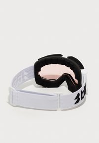 Skidigglar med ett vitt elastiskt band, svart skumvaddering och rosa linser. Har en slät yta och en tät passform för komfort.
