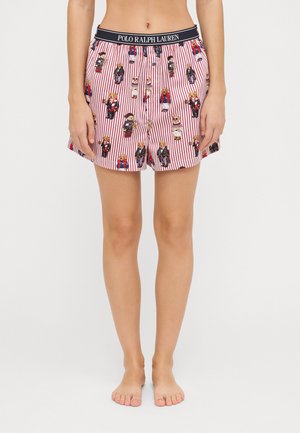 Baumwoll-Boxershorts mit rot-weißen vertikalen Streifen, versehen mit verschiedenen Hund Illustrationen. Elastischer Bund mit "POLO RALPH LAUREN" Logo.
