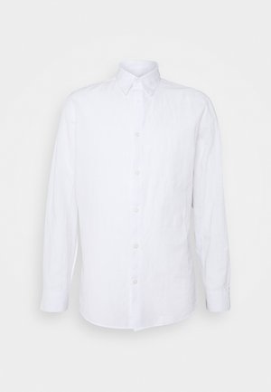 White long-sleeve shirt made of linen, featuring a button-up front, pointed collar, and a slightly textured fabric with side slits.