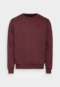 Sudadera burdeos de cuello redondo en una tela suave con puños y dobladillo acanalados. Presenta un pequeño logo oscuro en el pecho. Diseño clásico con un ajuste holgado.