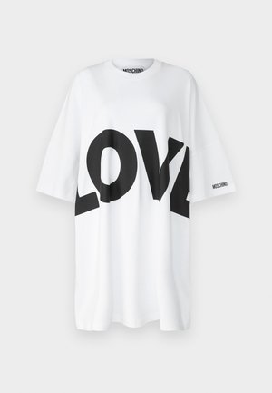 White oversized t-shirt with black "LOVE" graphic print and brand logo on the sleeve. Made of cotton with a smooth texture.