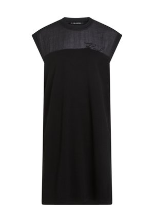 Μαύρο αμάνικο φόρεμα με υφασμάτινη επάνω επιφάνεια και λεπτή κεντημένη επιγραφή "Karl" κοντά στον ώμο, λαιμόκοψη γύρω από το λαιμό, ευθεία γραμμή.