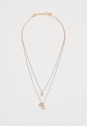 Kuldsetooniline kihiline kaelakee koos kahe ahelaga. Kätkeb endas väikest kristallist südame ripatsit ja poleeritud südame võlu. Reguleeritav pikkus.