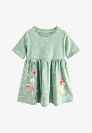 Abito di cotone verde menta con maniche corte, vita arricciata e stampa floreale. Presenta grafiche di conigli e fiori in colori pastello.