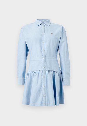 Helehall sinine pikkade varrukatega särkkleit nööbitava eesosa, kokkupandava seelikuga, terava krae ja väikese tikitud logoga rinnal.