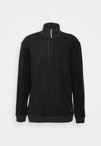 Schwarzer Fleece-Pullover mit Stehkragen, halbem Reißverschluss, langen Ärmeln und strukturierter Oberfläche. Verfügt über gerippte Bündchen und Saumdetails.