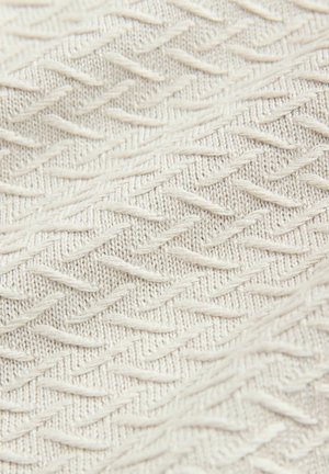 Kreemivärviline tekstureeritud kangas, millel on siksakmustiriba ja kõrgendatud niidid, mis lisavad sügavust ja mõõtmeid. Kerge ja pehme tekstuur.