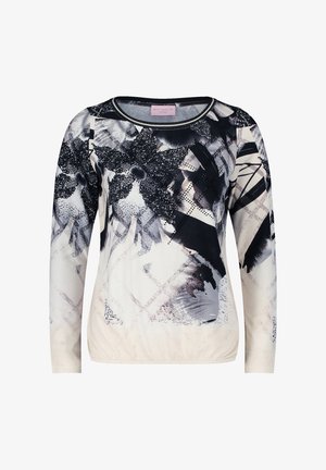 Langarmshirt mit einem schwarz-weißen abstrakten Blumenmuster auf hellem Hintergrund, aus weichem Stoff mit gerafftem Saum.