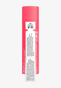 Rosafärgad cylindrisk behållare med en glansig yta, med en vit etikett som har svart text och ikoner, som beskriver produktinformation och användningsinstruktioner.