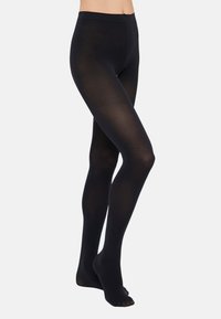Črne neprozorne nogavice z gladko teksturo, visoko zasnovo in prilegajočo silhueto, ki ima prozoren del prstov.
