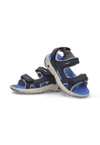Sandalias deportivas azul y gris con correas ajustables, plantilla texturizada y una suela gris claro con patrones antideslizantes.