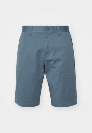 Blue cotton shorts featuring a button closure, belt loops, and side pockets. Smooth texture with a relaxed fit, reaching above the knee.