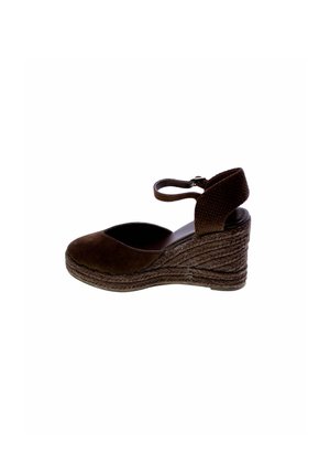 Scarpa espadrillas con zeppa marrone con cinturino alla caviglia e trama di corda intrecciata sul tallone e sulla suola platform.
