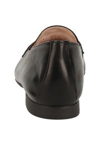 Schwarzer Lederschuh mit glatter Oberfläche, runder Zehenform und niedrigem Absatz. Das Design zeichnet sich durch eine minimalistische Silhouette und subtile Nähdetails aus.