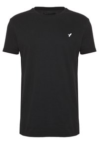 Black crew neck t-shirt made from cotton. Short sleeves, regular fit, features a small embroidered white bird logo on the chest.