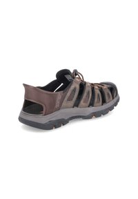 Brown mesh and synthetic sandals with vibrant orange accents, featuring a secure lace toggle and reinforced rubber soles for grip.