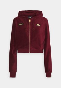 Sudadera corta burdeos con cremallera y cordones, cremallera dorada y dos parches con acentos dorados en el pecho de la marca Ellesse.