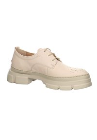 Chaussure beige en cuir à lacets avec semelle épaisse texturée et détails perforés sur l\'avant, conçue pour une tenue décontractée ou formelle.