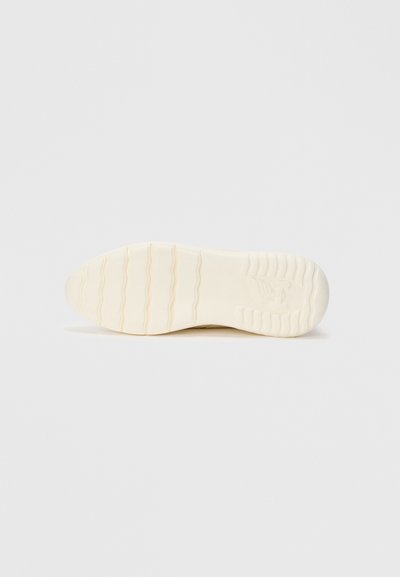 White shoe sole with wavy tread pattern and embossed logo at the heel, shown against a plain white background.