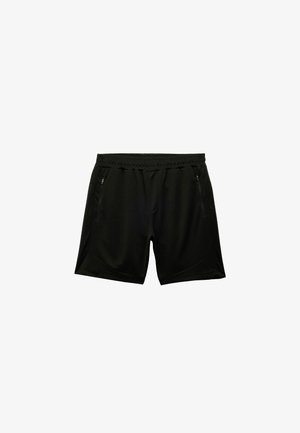 Zwarte sportbroekjes met een elastische tailleband, twee ritszakken, een gladde textuur en een taps toelopend ontwerp.