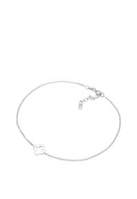 Silver bracelet with a delicate chain, featuring a small, decorative clover-shaped charm. Adjustable clasp for size customization.
