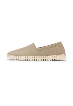 Beige slip-on shoe with a smooth upper and thick white sole featuring deep, evenly spaced grooves.