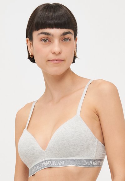 Grey fabric bra with a smooth texture, V-neck design, thin adjustable straps, and a branded elastic band featuring "Emporio Armani."