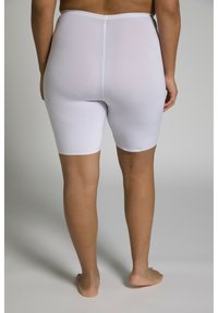 Pantaloni bici bianchi realizzati in materiale elasticizzato, di lunghezza a metà coscia, caratterizzati da una texture liscia e un design semplice, senza elementi hardware visibili.