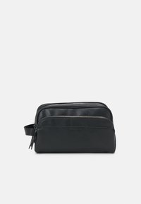 Black zippered travel bag with a smooth leather texture, rectangular shape, and side handle. Features a front zip compartment.
