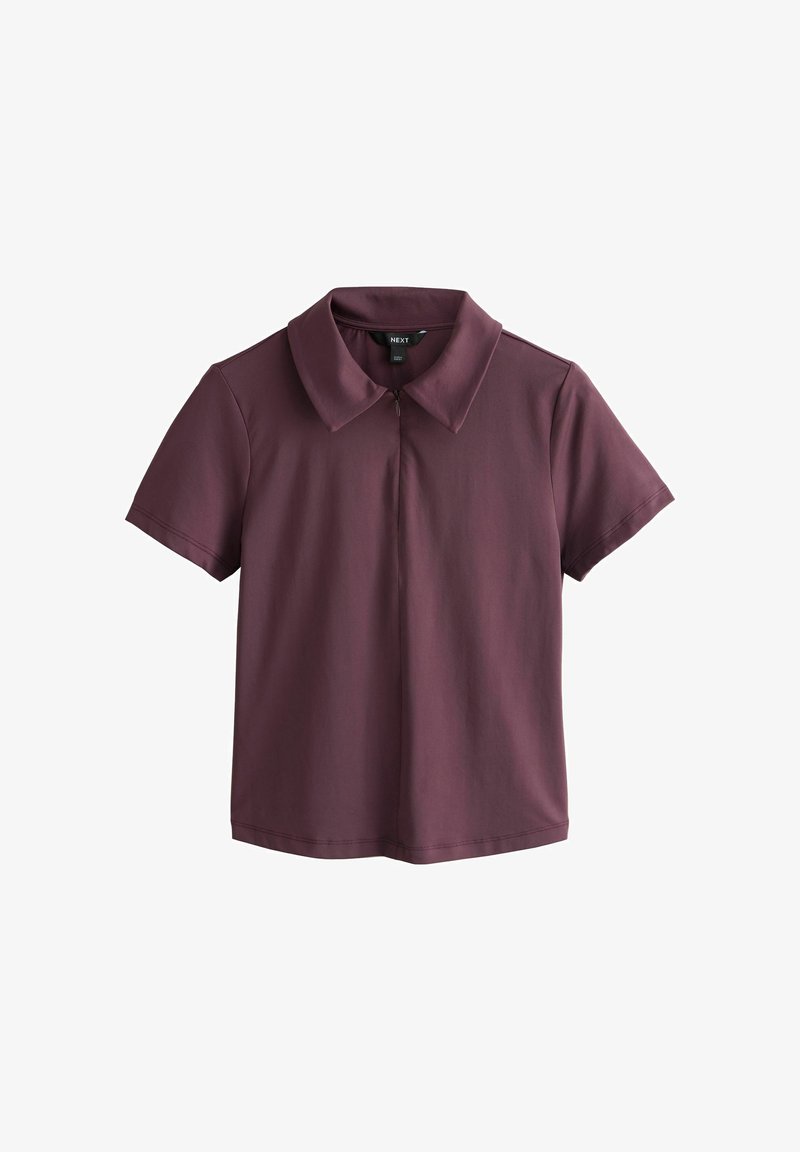 Chemise bordeaux à manches courtes avec col et fermeture éclair à l'avant, présentée à plat sur un fond blanc.