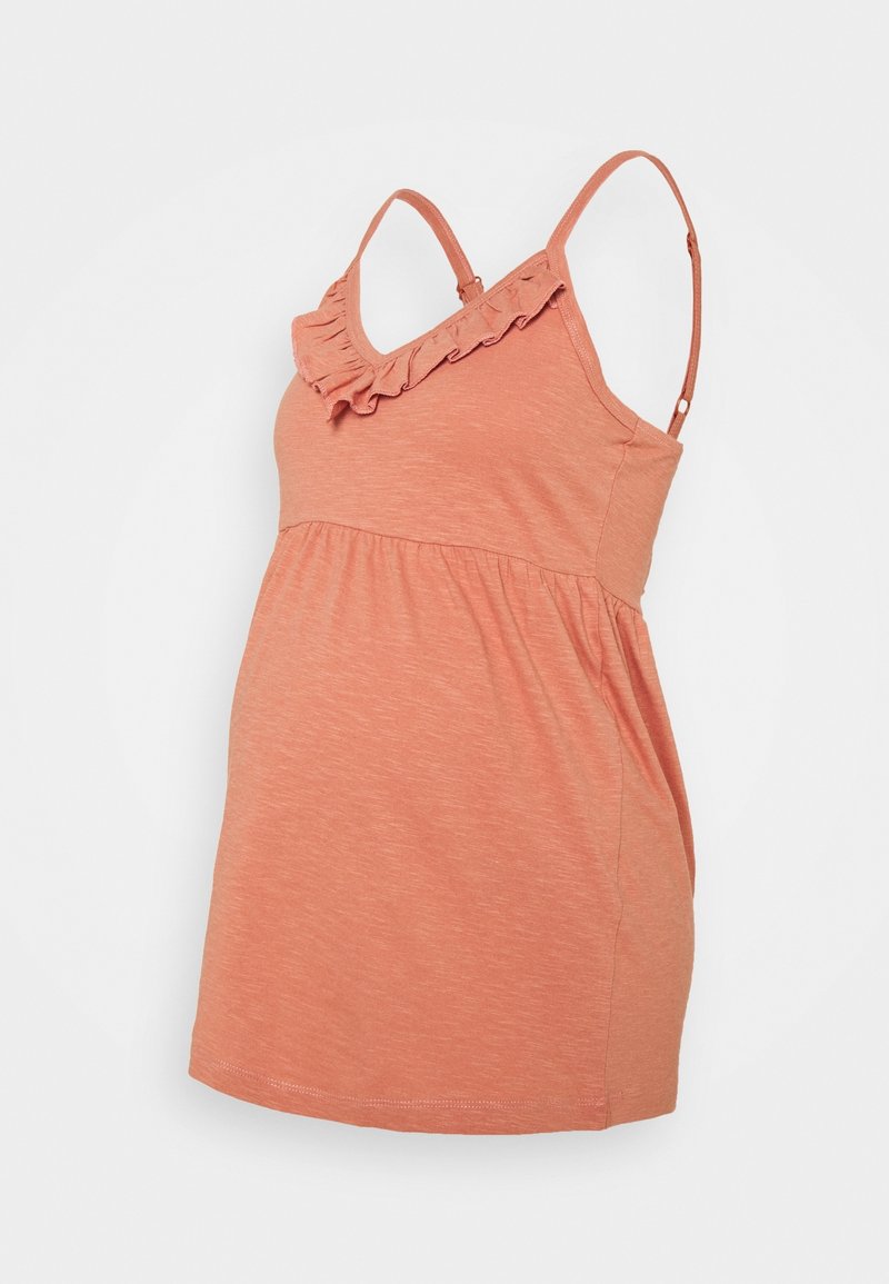 Zwangerschapstop in koraal met een gerimpelde halslijn. Gemaakt van zachte, lichte stof. Voorzien van verstelbare bandjes en een aansluitende bodice voor comfort.