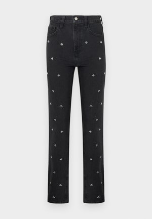 Jeans noirs à jambes droites avec de petits motifs de petites abeilles argentées brodés répartis uniformément sur le devant.