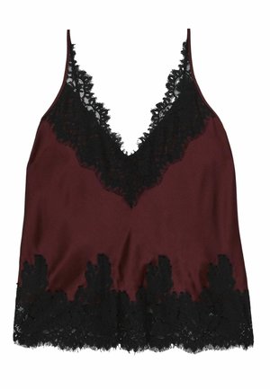 Burgundowa satynowa bluzka na ramiączkach z czarną koronką, z głębokim dekoltem w kształcie V i falbaniastym wykończeniem z koronką. Gładka faktura materiału.