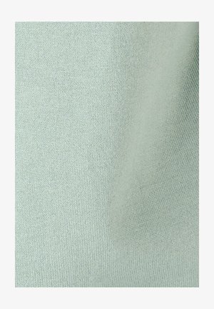 Lichtgrijze gebreide stofstructuur met fijne, uniforme stiksels en zachte plooien zichtbaar aan de rechterkant.