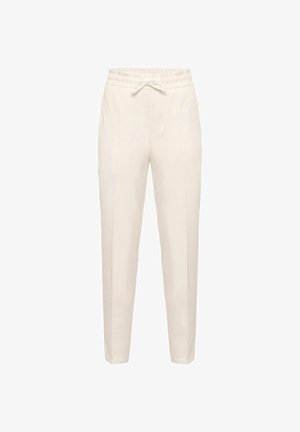Pantalon beige sur mesure avec une taille élastique et un cordon de serrage. Comprend deux poches latérales et une texture de tissu lisse et légère.