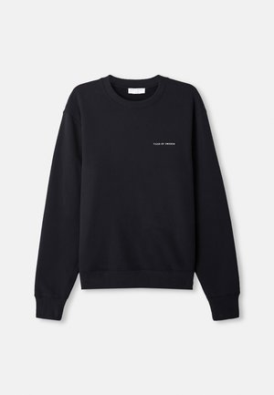 Black sweatshirt with a crew neck, ribbed cuffs, and hem. Features white text that reads "TIGER OF SWEDEN" on the chest. Soft texture.