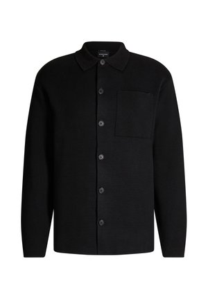 Cardigan en tricot noir avec col, poche frontale et patte de boutonnage. Il présente des manches longues et un tissu texturé.
