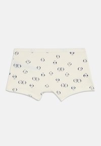 Kremfargede boyshorts med et spredt mønster av svarte og hvite pandaansikter, lagt flatt på en hvit bakgrunn.
